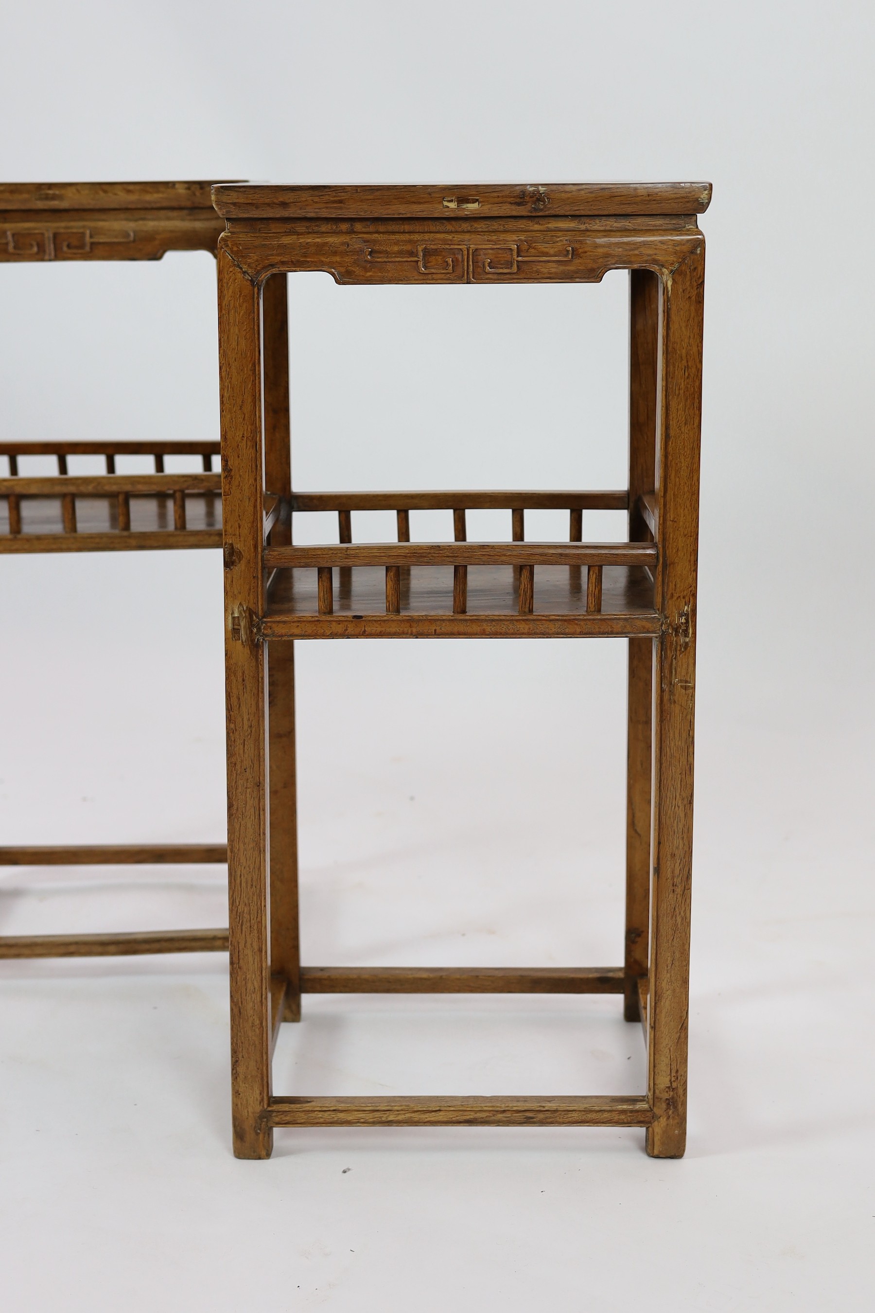 A pair of Chinese elm incense stands, 19th century, 39cm wide, 83.5cm high, 30cm deep